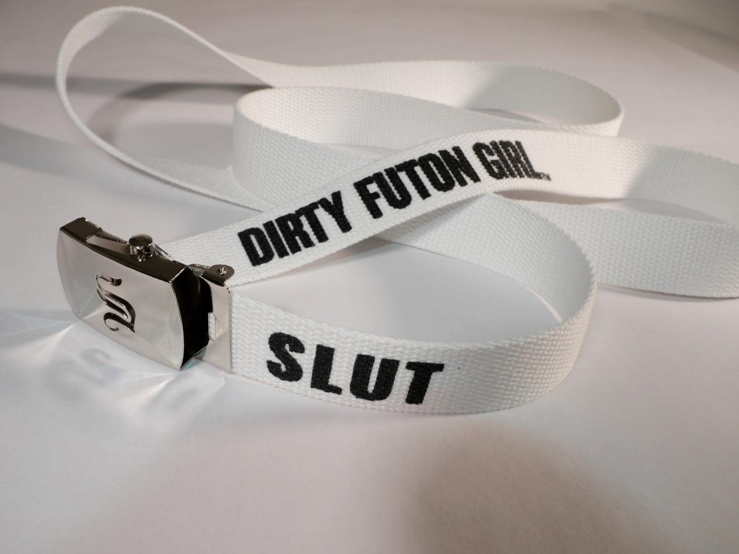 Slut belt. 70 inch long woven web belt with silver buckle and metal tips. Reversible Dirty Futon Girl logo and We Love Sluts screenprint.